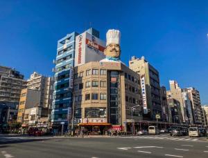 a building with a statue of a chef on top of it at Minn Asakusa Kappabashi in Tokyo +7 photos