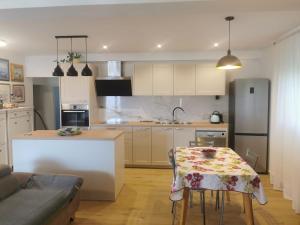 a kitchen with a table with a table cloth on it at Tonka 1 in Podstrana