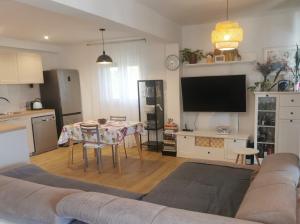 a living room with a couch and a table at Tonka 1 in Podstrana