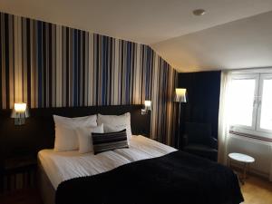 Postel nebo postele na pokoji v ubytování Quality Hotel Statt