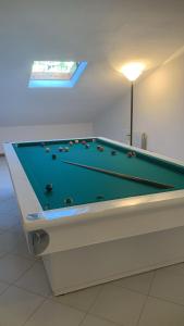 a pool table sitting in a room with afits at valle del paradiso 9 in Seggiano