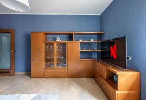 a large wooden cabinet with a red x on it at Como Lake, 6 Posti, Vista Monti, Clima e Garage in Lecco