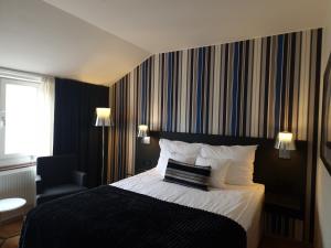 Postel nebo postele na pokoji v ubytování Quality Hotel Statt + 22 fotografií
