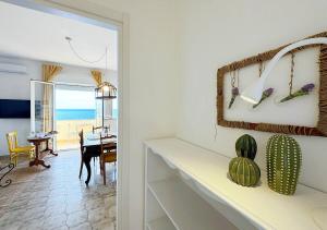 a living room with a view of the ocean at Solemar Sicilia - Casa Dolce in Bagheria