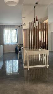 a living room with a white bench in a room at Вилла,Дача на берегу моря in Baku +16 photos