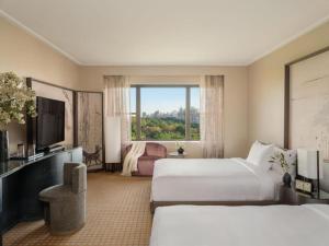 Postel nebo postele na pokoji v ubytování Hotel New Tela Plaza Near IGI Airport Delhi