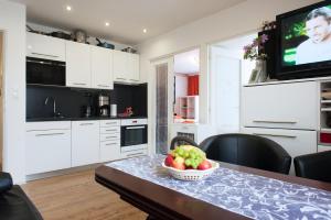 Kuchyň nebo kuchyňský kout v ubytování Best Residence Expo