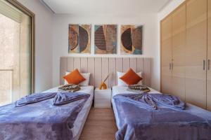 Postel nebo postele na pokoji v ubytování Alma Prestigia Appartments