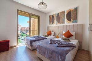 Postel nebo postele na pokoji v ubytování Alma Prestigia Appartments