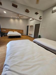 Postel nebo postele na pokoji v ubytování Gold Plus Homestay 5968
