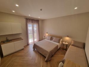 Postel nebo postele na pokoji v ubytování Le Muse Pompei B&B