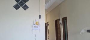 a hallway of a hospital with a mirror at GriyaAdelisca in Darmasaba