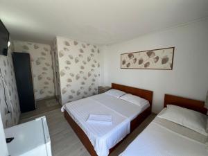 Postel nebo postele na pokoji v ubytování Casa Flaviu Eforie Sud