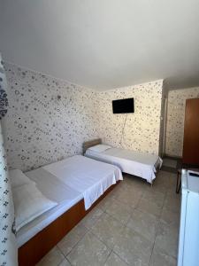 Postel nebo postele na pokoji v ubytování Casa Flaviu Eforie Sud