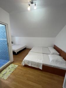 Postel nebo postele na pokoji v ubytování Casa Flaviu Eforie Sud