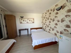 Postel nebo postele na pokoji v ubytování Casa Flaviu Eforie Sud