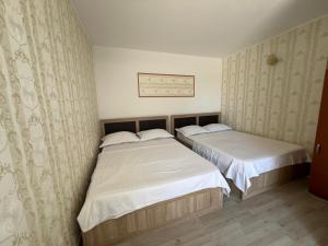 Postel nebo postele na pokoji v ubytování Casa Flaviu Eforie Sud