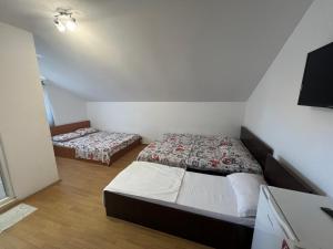 Postel nebo postele na pokoji v ubytování Casa Flaviu Eforie Sud
