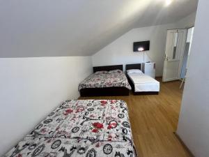Postel nebo postele na pokoji v ubytování Casa Flaviu Eforie Sud