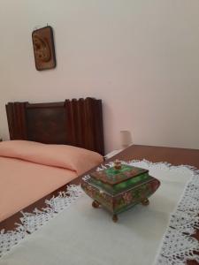 a room with a table in the middle of a bed at da Mescia Maria in Morciano di Leuca