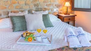 A bed or beds in a room at Casa La Buhardilla del Gastor by Ruralidays