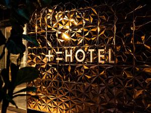 a hotel sign on the side of a building at 十二ホテル -福岡空港- in Fukuoka