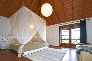 En eller flere senge i et værelse på Casa El Buen Jesús