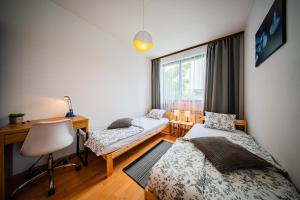 Postel nebo postele na pokoji v ubytování Flex SelfCheckIns 158 - Zagreb - 2 Bedrooms - Parking - Terrace