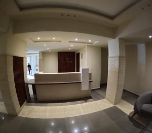 a lobby with a reception desk in a building at avenue compound in Hurghada