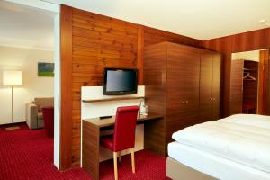 TV a/nebo společenská místnost v ubytování H+ Hotel & SPA Engelberg