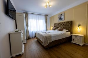 Giường trong phòng chung tại Vila Petersdorf