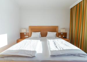 Posteľ alebo postele v izbe v ubytovaní Genusshotel Fichtenhof