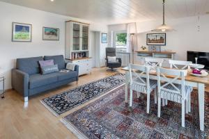 a living room with a table and a couch at Ferienwohnung Millot in Gernsbach