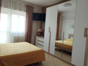 Ένα ή περισσότερα κρεβάτια σε δωμάτιο στο Il Melograno - Just like at home!