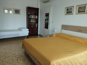 Ένα ή περισσότερα κρεβάτια σε δωμάτιο στο Il Melograno - Just like at home!