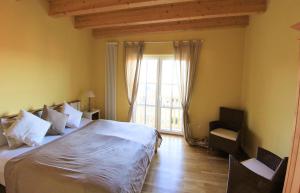 Postel nebo postele na pokoji v ubytování Ferienwohnung Villa Albatros In Oberdellach + 3 fotografie
