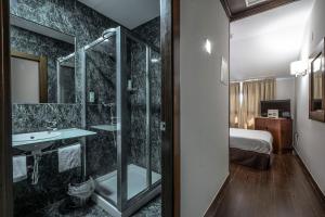 Koupelna v ubytování Hotel Hidalgo