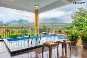 a view of a swimming pool from a house at EKOSTAY - Casa Den in Igatpuri