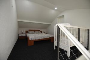 a bedroom with a bunk bed and a staircase at Apartments Duplex Oliva in Trebinje