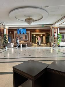 a large lobby with a large dance floor in a building at فندق مراج طيبه Mirage Taiba Hotel in Medina +60 photos