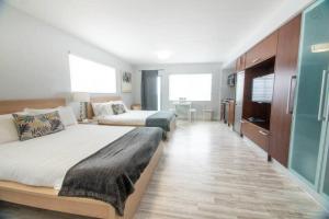 Ένα ή περισσότερα κρεβάτια σε δωμάτιο στο Ocean Drive Studio Roof top Pool and Bar