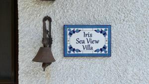 a picture of a sea view village with a bell at Iris Sea View Villa in Afissos