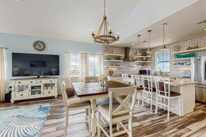 a kitchen and dining room with a table and chairs at Seaside Breezes in Padre Island