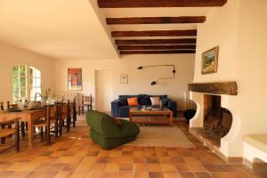 a living room with a couch and a fireplace at Sur mer in Hyères