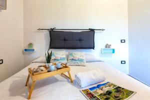 Postel nebo postele na pokoji v ubytování Villetta Via Li Cossi