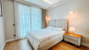 Postel nebo postele na pokoji v ubytování Sirius Town by AntalyaSuites