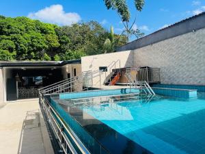 a swimming pool on top of a building at Condomínio Lidiane in Belém