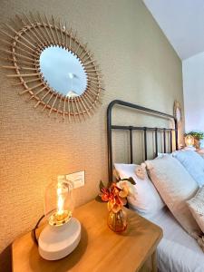 a bedroom with a bed and a table with a mirror at GATU Villa Luna Casa de campo con piscina privada in Melegis