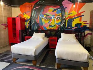 Postel nebo postele na pokoji v ubytování LOFT Hotel by Sommelier Hoteles