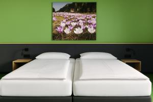 Cama ou camas em um quarto em Hotel Simader